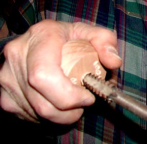 Hand threading the carved mold portion of a butter mold